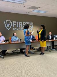 Karen Scott (left) swears in Gwendolyn Dowdy-Rodgers (right).